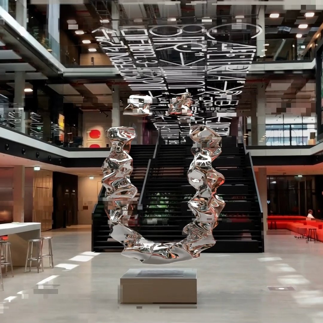 house of communication with an "Ü" statue inside